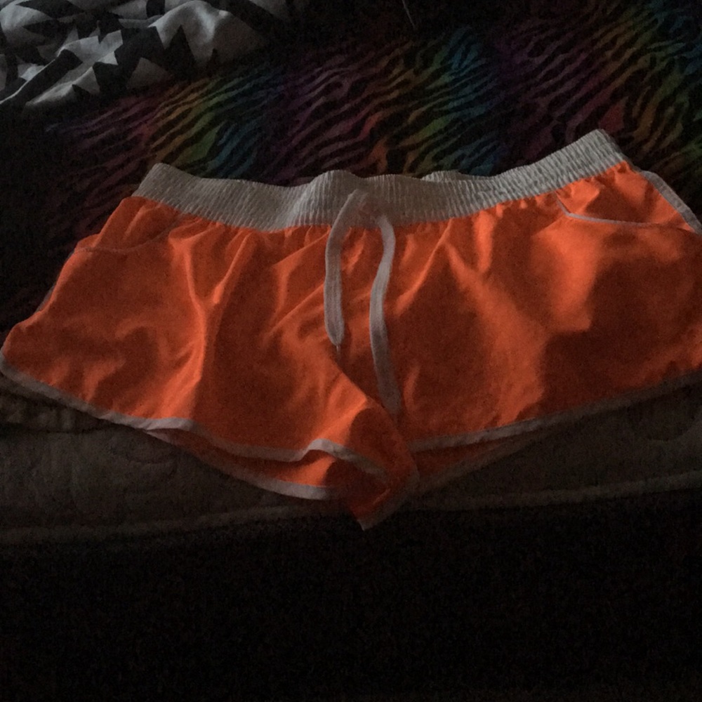 Orange and white swimming shorts